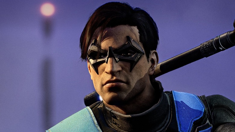 A screenshot from Gotham Knights, showing a close-up of Nightwing, who has one of his Escrima sticks over his shoulder.